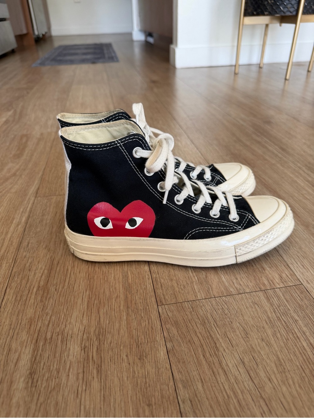 Comme Des Garcons PLAY
x Converse Unisex Chuck Taylor High Top Sneakers